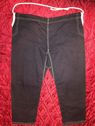 Shoyoroll Batch #8: The Yank, a navy blue Jiu-Jitsu gi featuring a lightweight 450 GSM pearl weave jacket and 12 oz ripstop cotton pants, part of the East vs. West series inspired by baseball legend 'The Great Bambino.' Includes contrast stitching, a foam collar, stretchy drawstring, ID/iPod pocket, and custom inner taping.