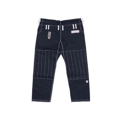Shoyoroll Batch #8: The Yank, a navy blue Jiu-Jitsu gi featuring a lightweight 450 GSM pearl weave jacket and 12 oz ripstop cotton pants, part of the East vs. West series inspired by baseball legend 'The Great Bambino.' Includes contrast stitching, a foam collar, stretchy drawstring, ID/iPod pocket, and custom inner taping.