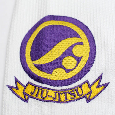 Shoyoroll Batch #8 White Mamba Gi, featuring a lightweight 450 GSM pearl weave jacket and 12 oz ripstop pants. Designed by artist John Smalls, this gi showcases a white base with purple trim. Released as part of the East vs. West Series on December 22, 2010, at 3:00 PM PST.