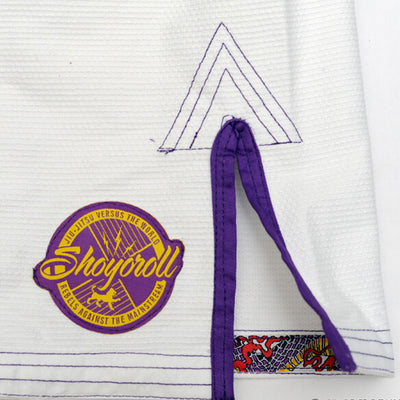 Shoyoroll Batch #8 White Mamba Gi, featuring a lightweight 450 GSM pearl weave jacket and 12 oz ripstop pants. Designed by artist John Smalls, this gi showcases a white base with purple trim. Released as part of the East vs. West Series on December 22, 2010, at 3:00 PM PST.