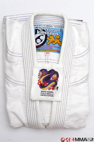 Shoyoroll Batch #8 White Mamba Gi, featuring a lightweight 450 GSM pearl weave jacket and 12 oz ripstop pants. Designed by artist John Smalls, this gi showcases a white base with purple trim. Released as part of the East vs. West Series on December 22, 2010, at 3:00 PM PST.